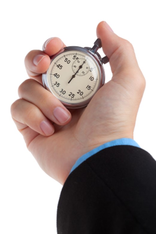 A hand holds a stopwatch